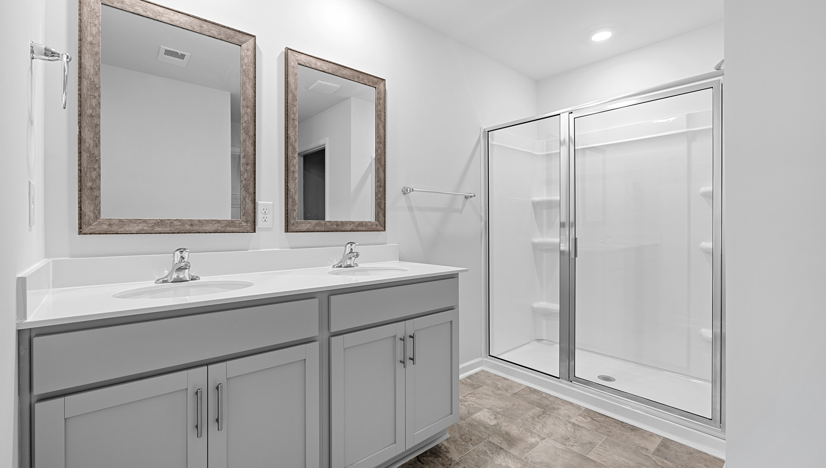 Bathroom with vanity and walk in shower.