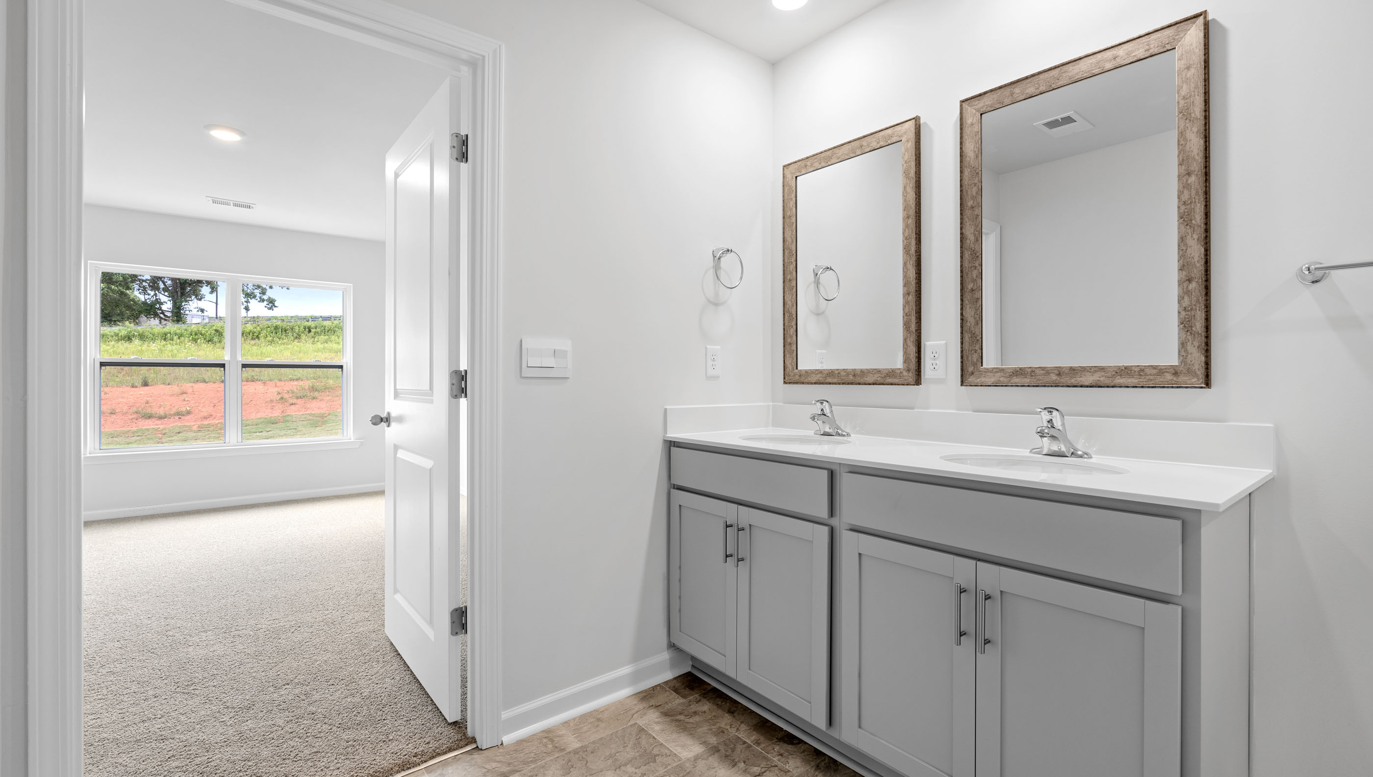 Bathroom with vanity and walk in shower.