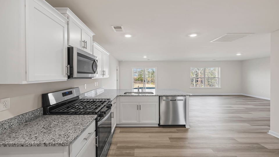 Kitchen and island with granite countertops.