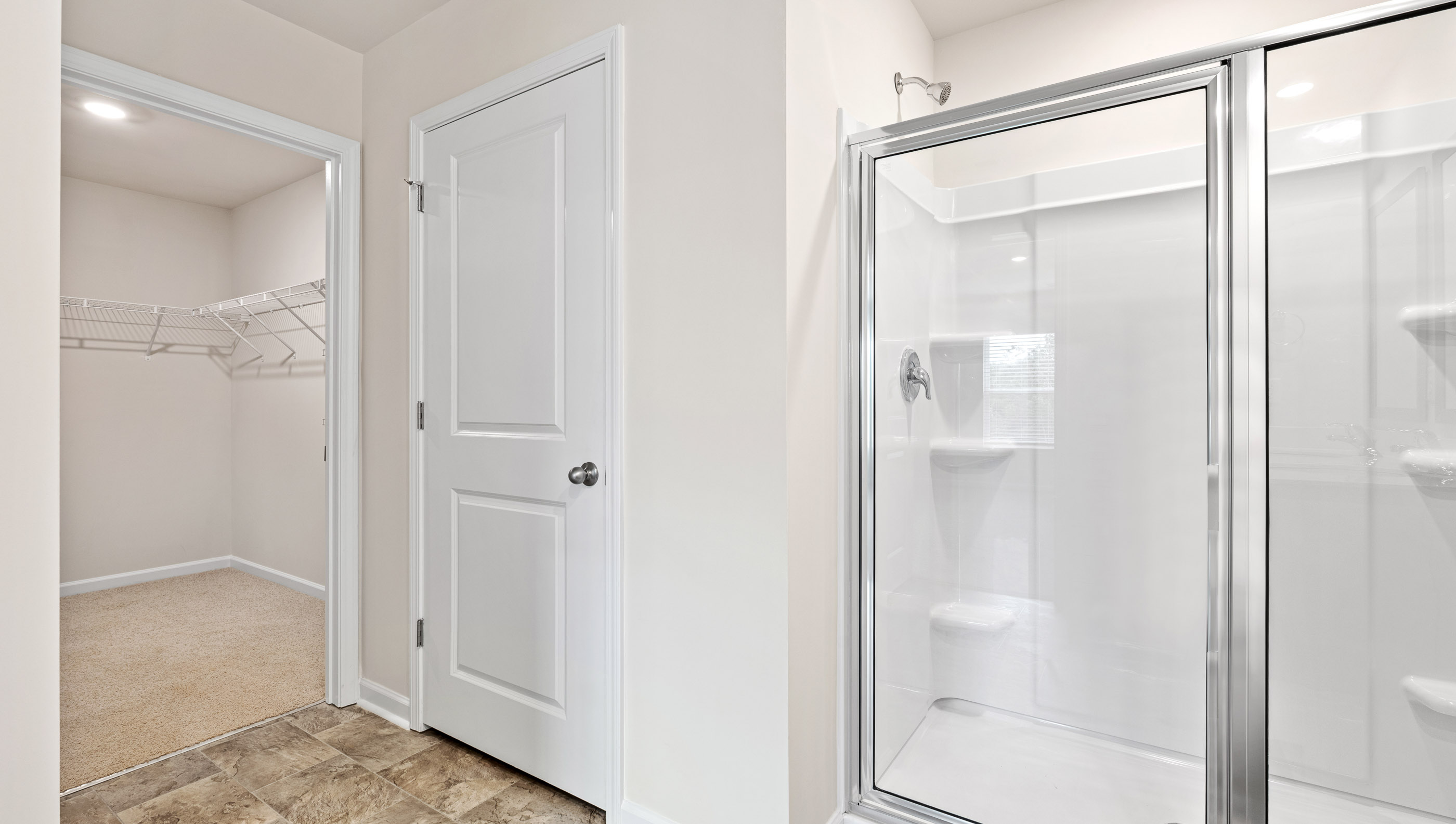 Bathroom with walk in shower.