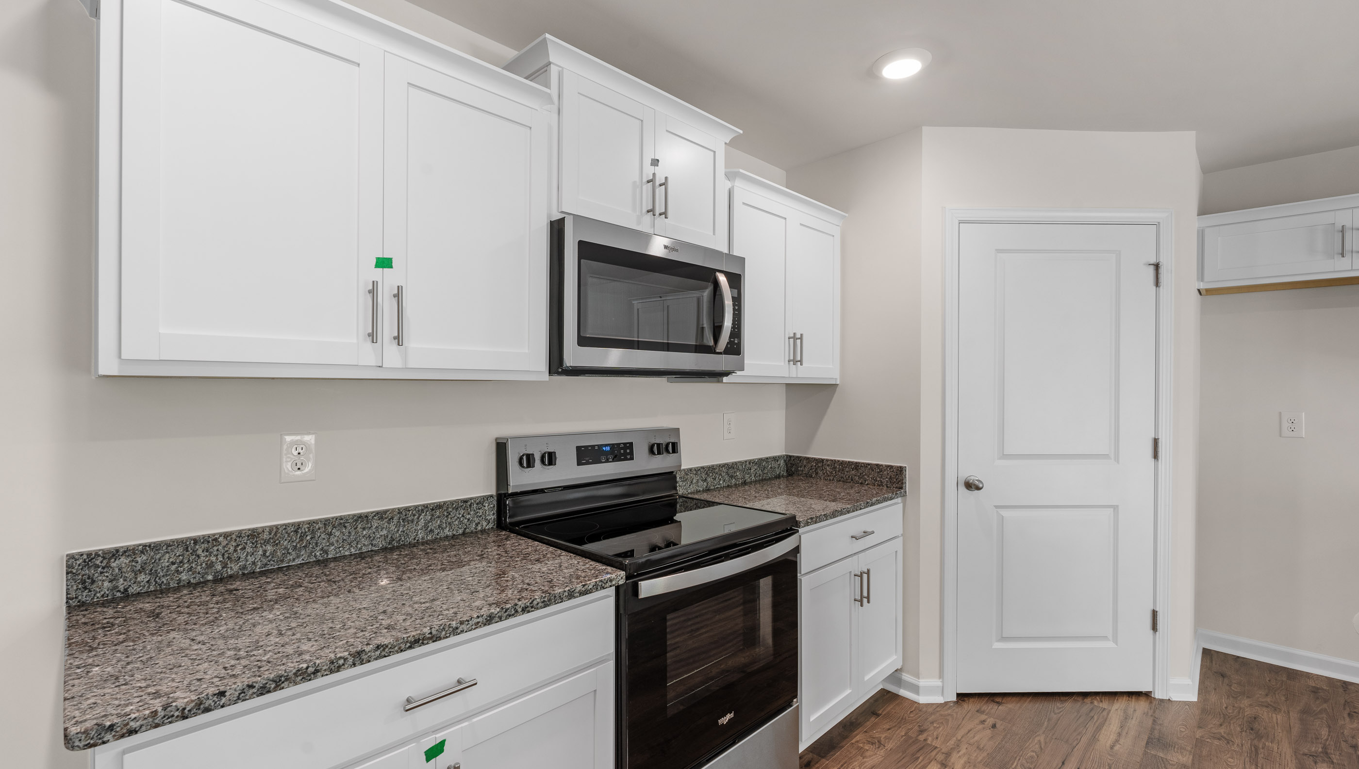 Kitchen with stainless steel appliances and granite countertops.