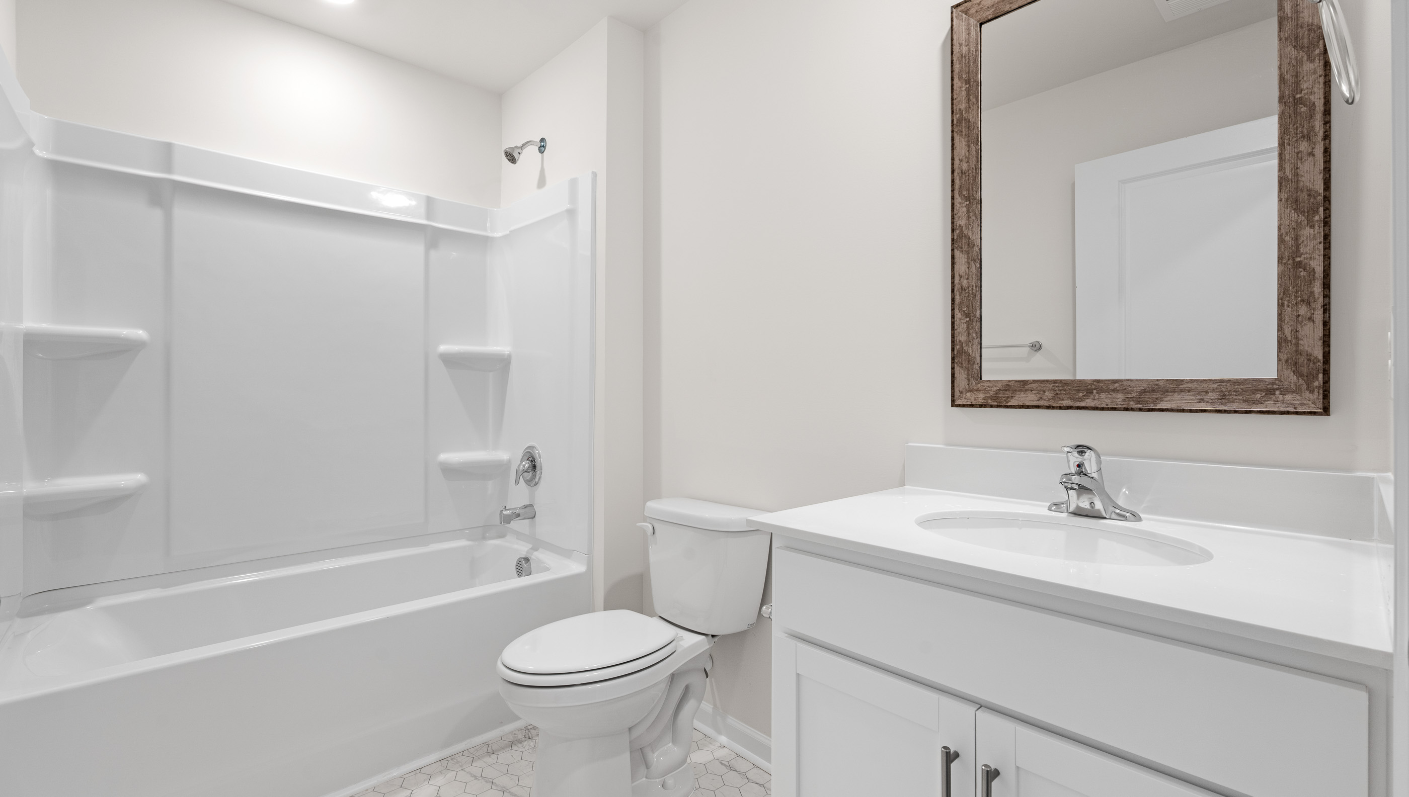 Bathroom with vanity and tub.