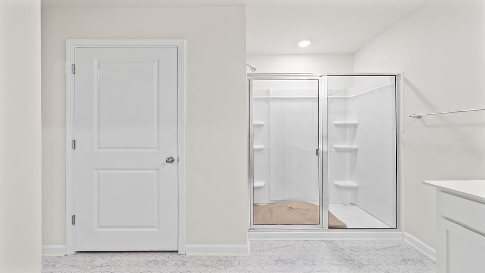 Bathroom with walk in shower.