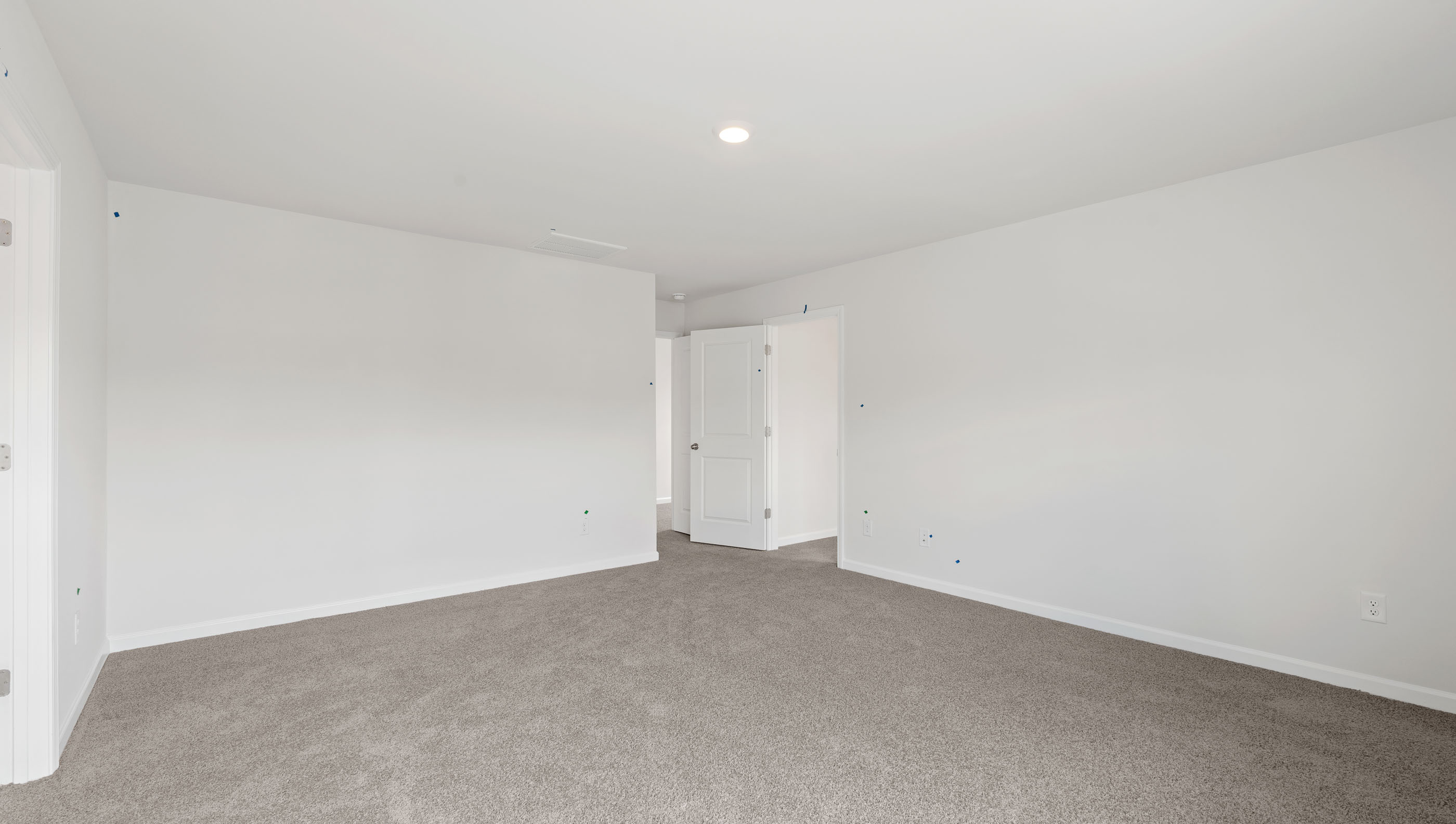 Bedroom with carpet and window.
