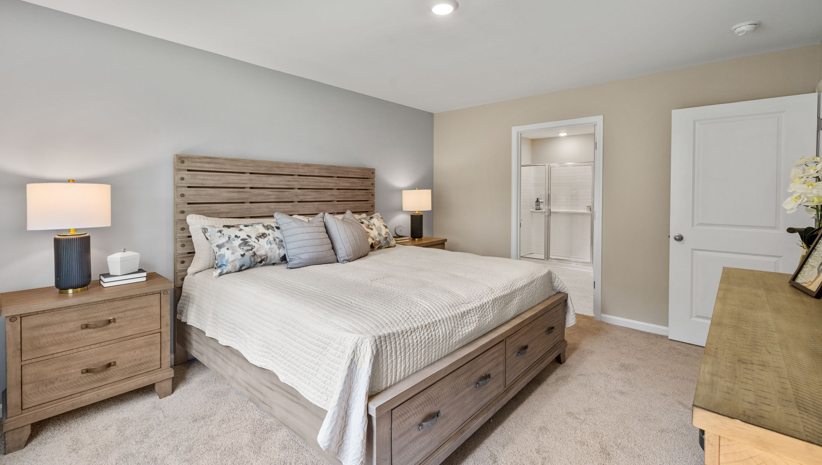 Bedroom with carpet and windows.