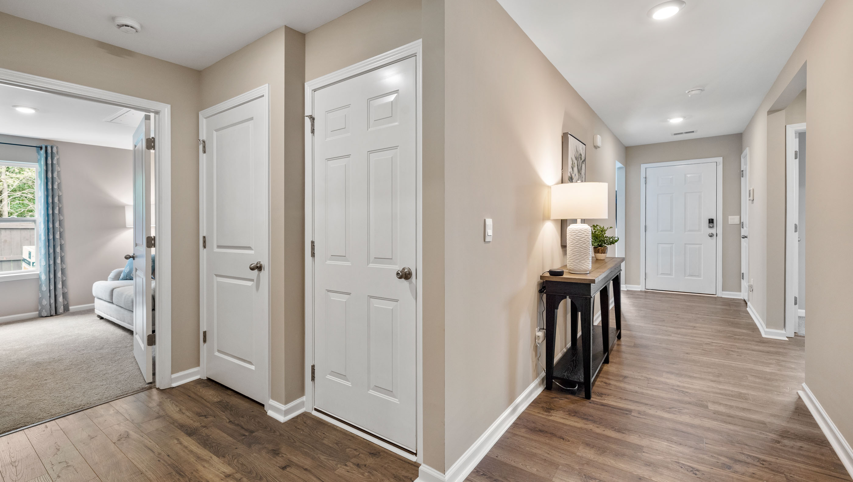 Entry way into home with view of rooms.