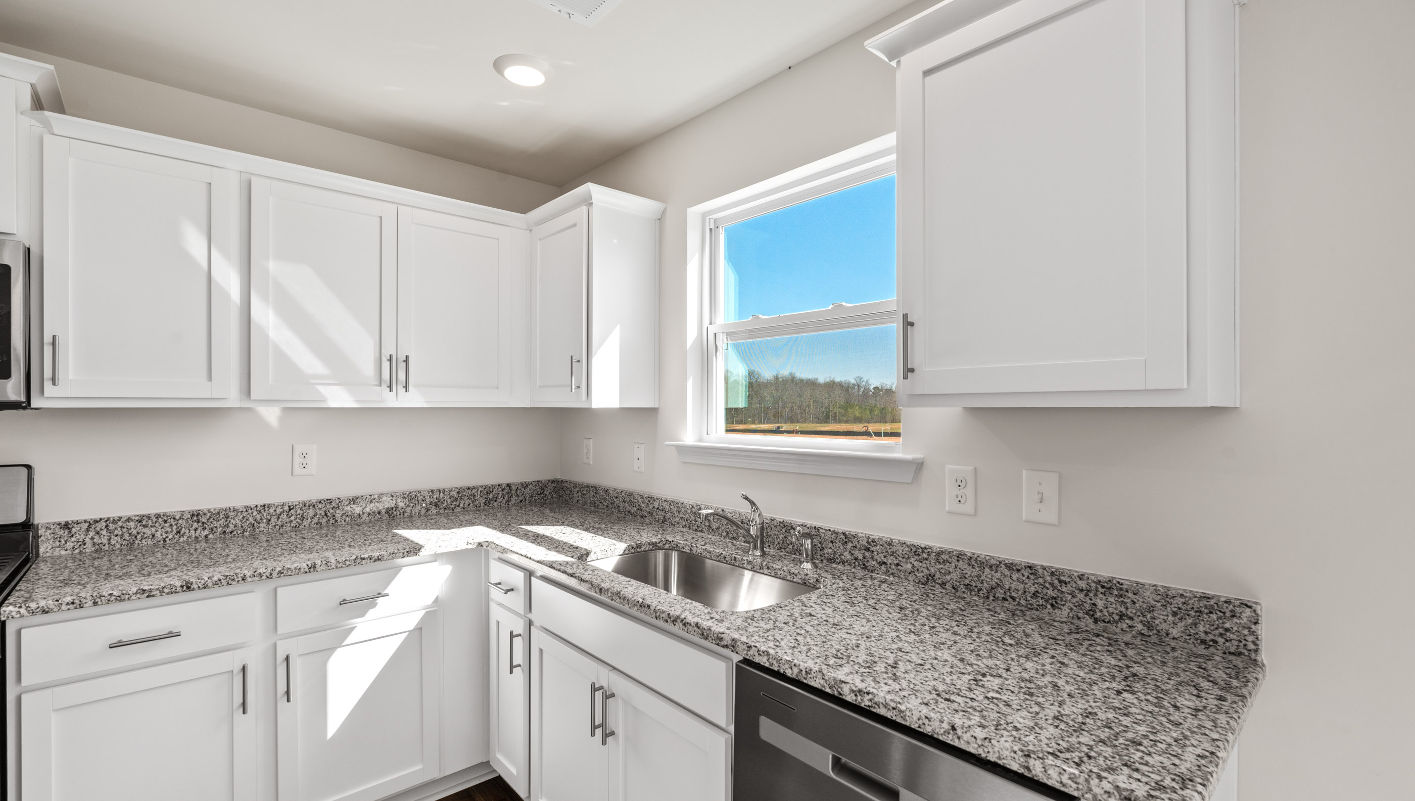 Kitchen with granite counter tops.