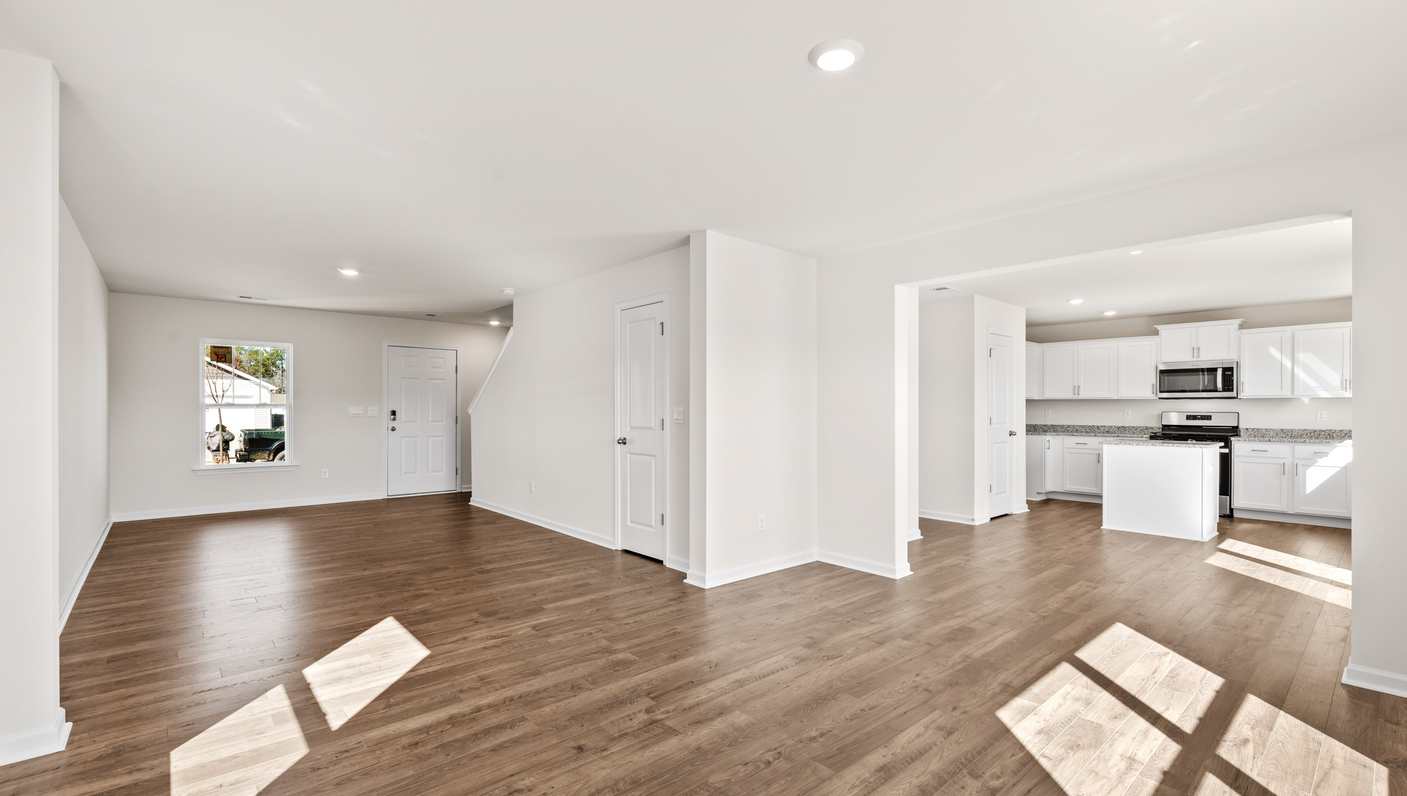 Family room with view of kitchen.