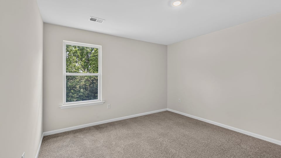 Bedroom with carpet.