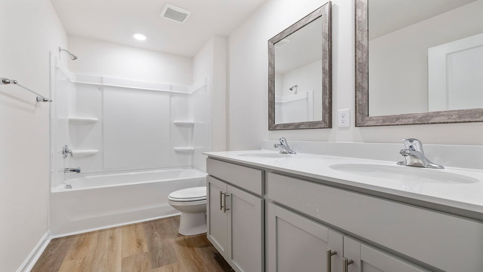 Bathroom with vanity and tub.