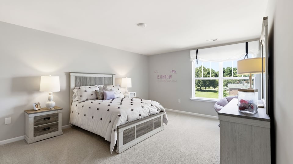 Bedroom with carpet and window.