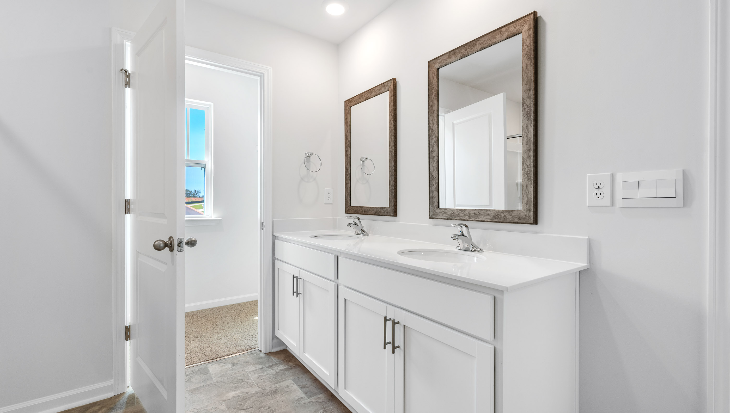 Bathroom with dual vanity.