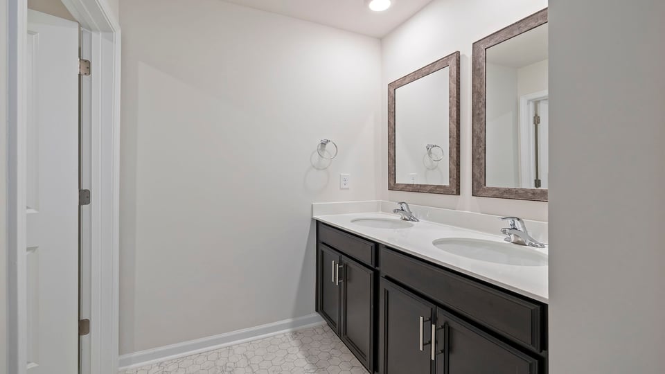 Bathroom with dual vanity.