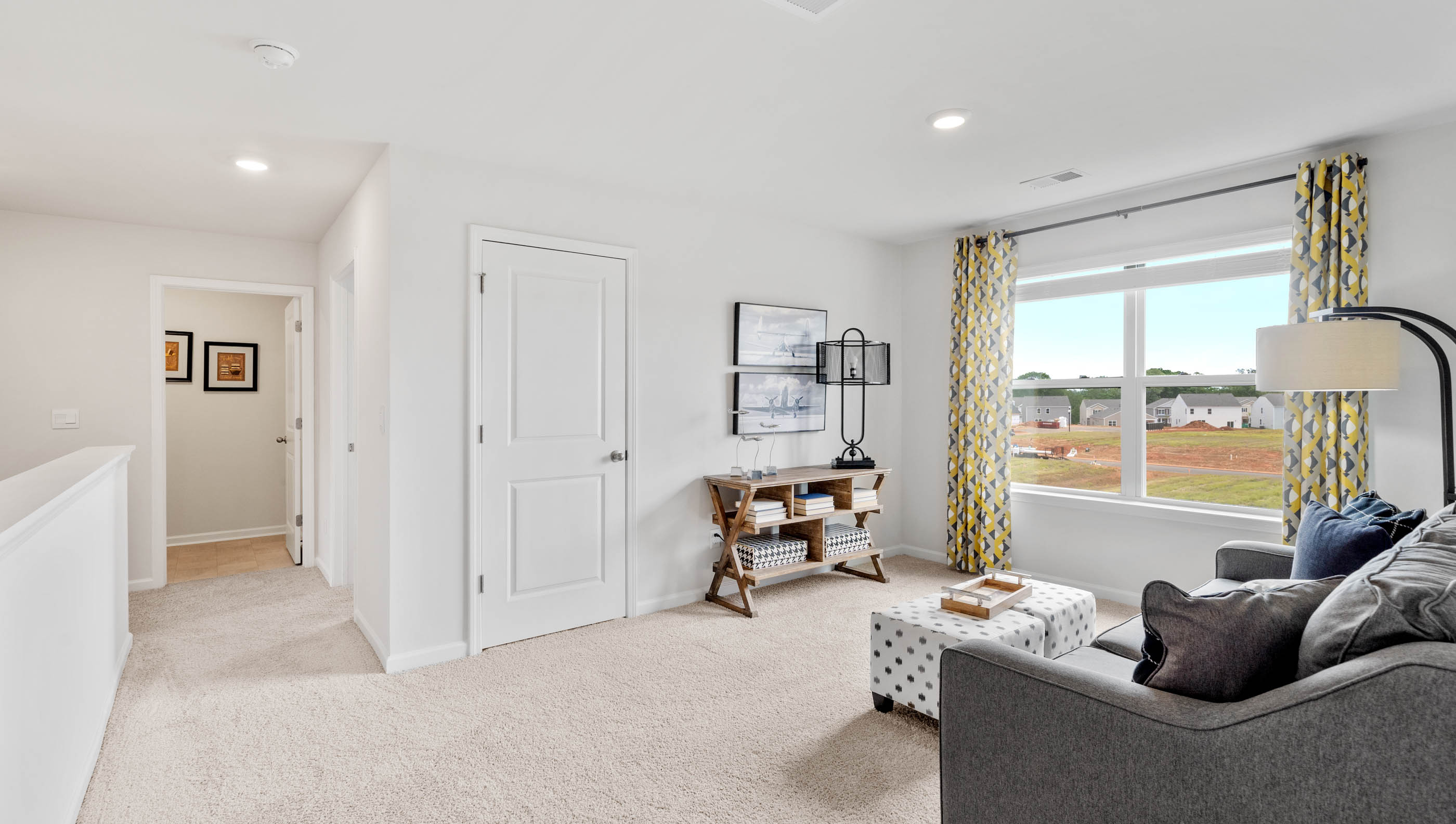 Loft area with carpet.