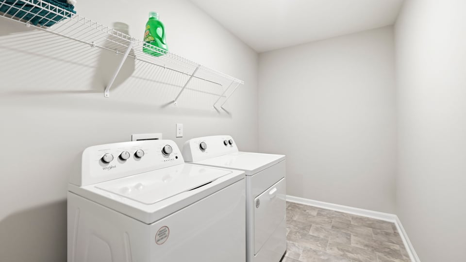 Laundry room with hanging storage racks.