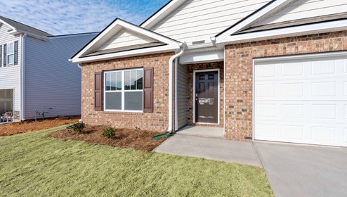 Front exterior of Cali with 2 car garage.