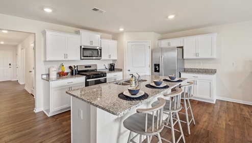 Kitchen with island and granite counter tops.