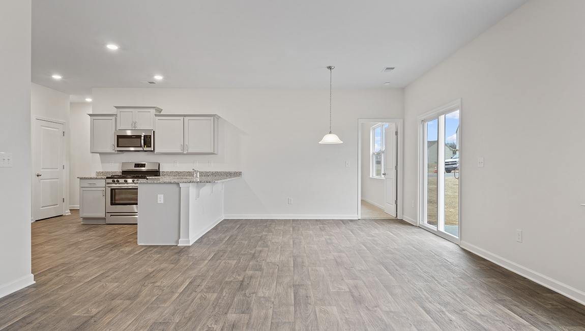 Living room with view of kitchen.
