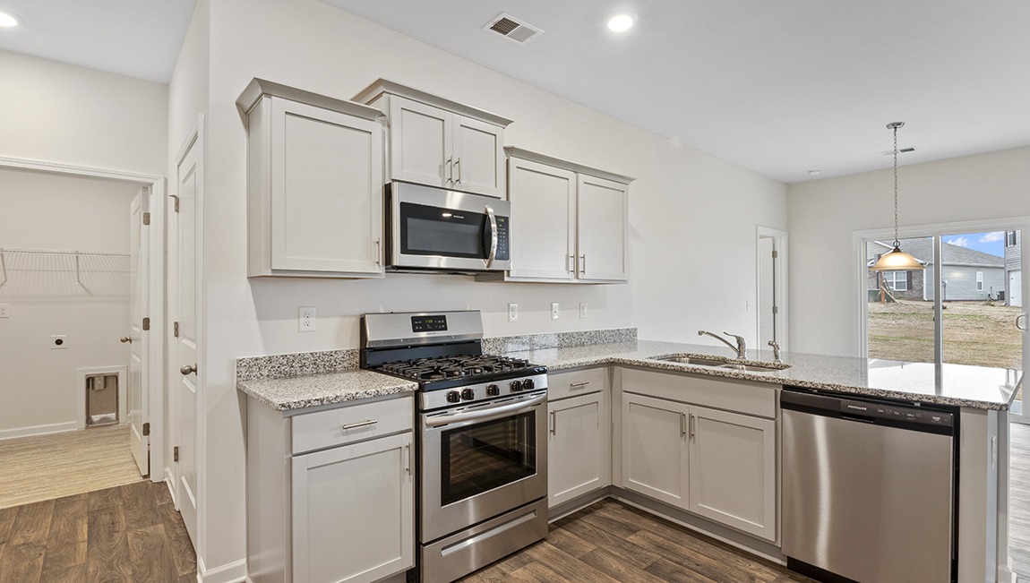 Kitchen and island with granite counter tops.