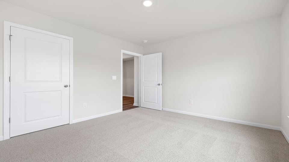 Bedroom with carpet.
