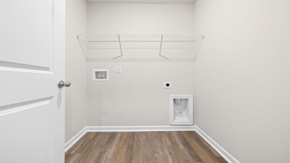 Walk in laundry with shelves.