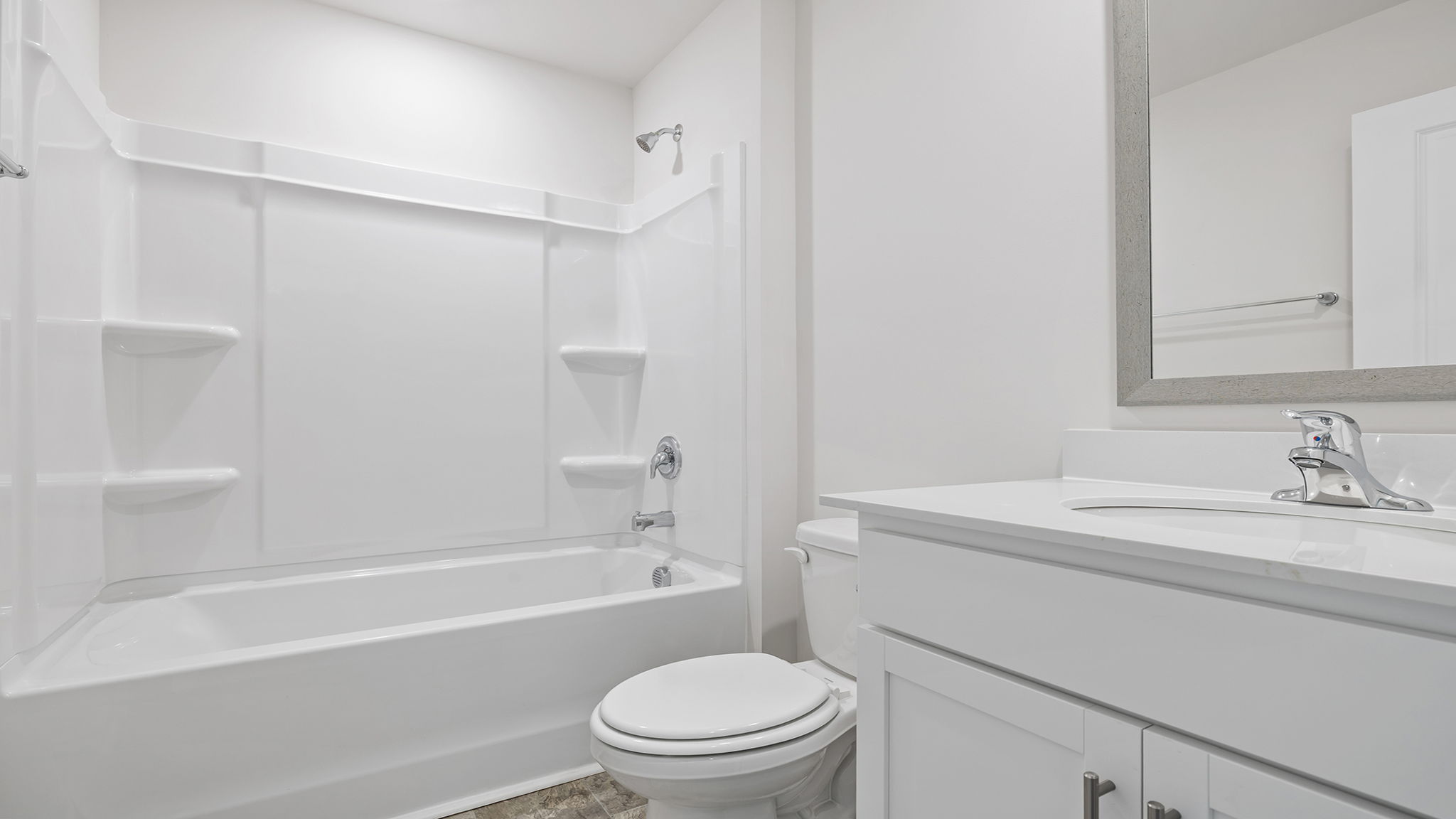 Bathroom with single vanity sink and tub.