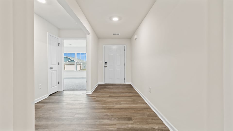 Hallway with view of rooms.