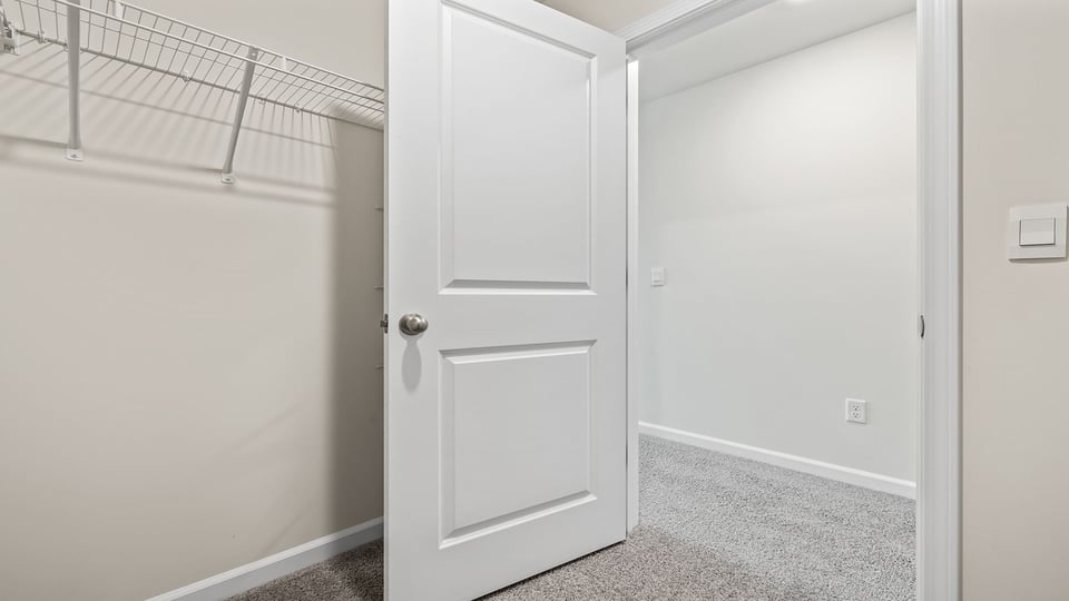 Closet with hanging storage racks.