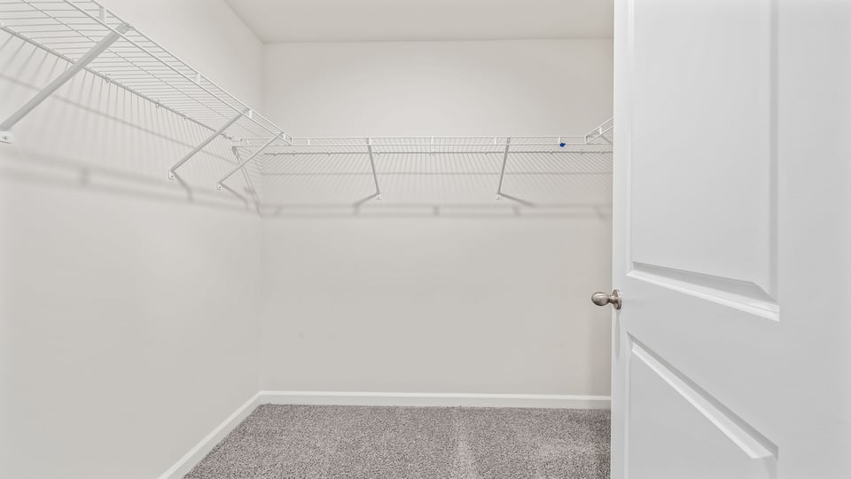 Closet with hanging storage racks.