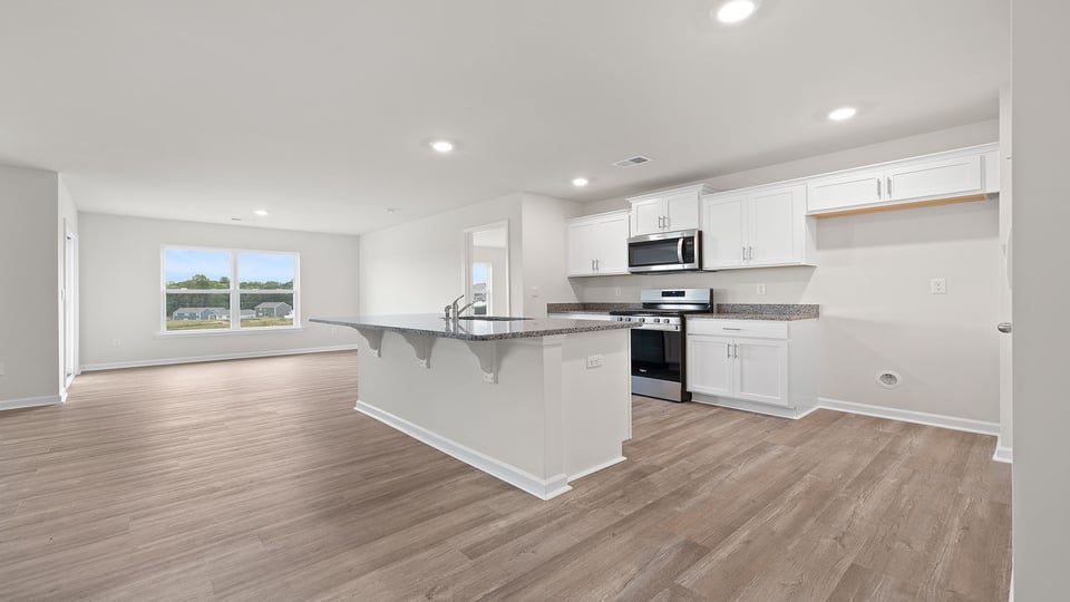 Kitchen and island with granite countertops.