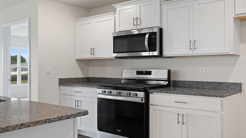 Kitchen and island with granite countertops.