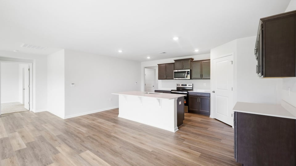 Kitchen with island and countertops.