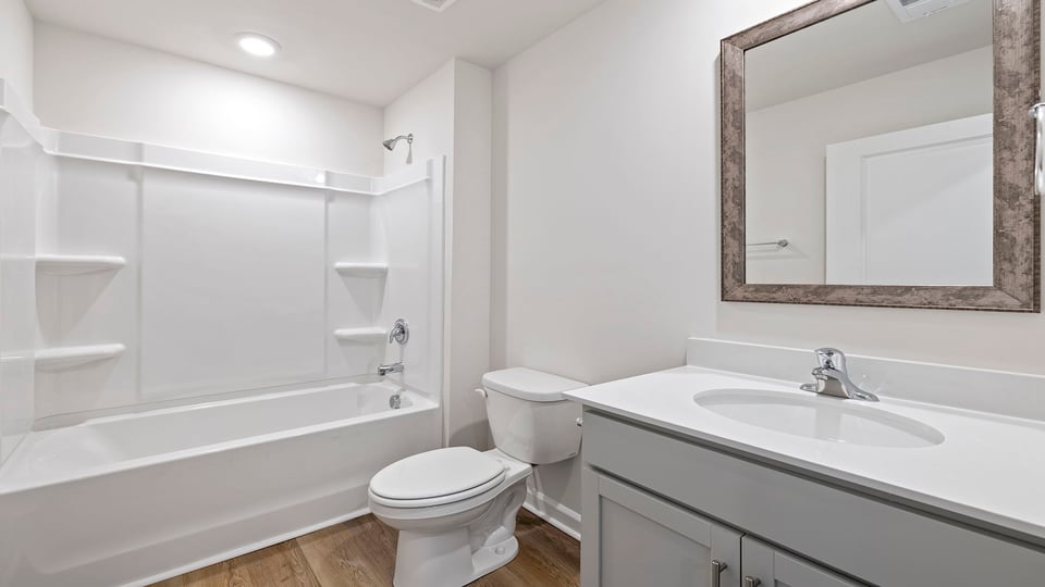 Bathroom with vanity and tub.