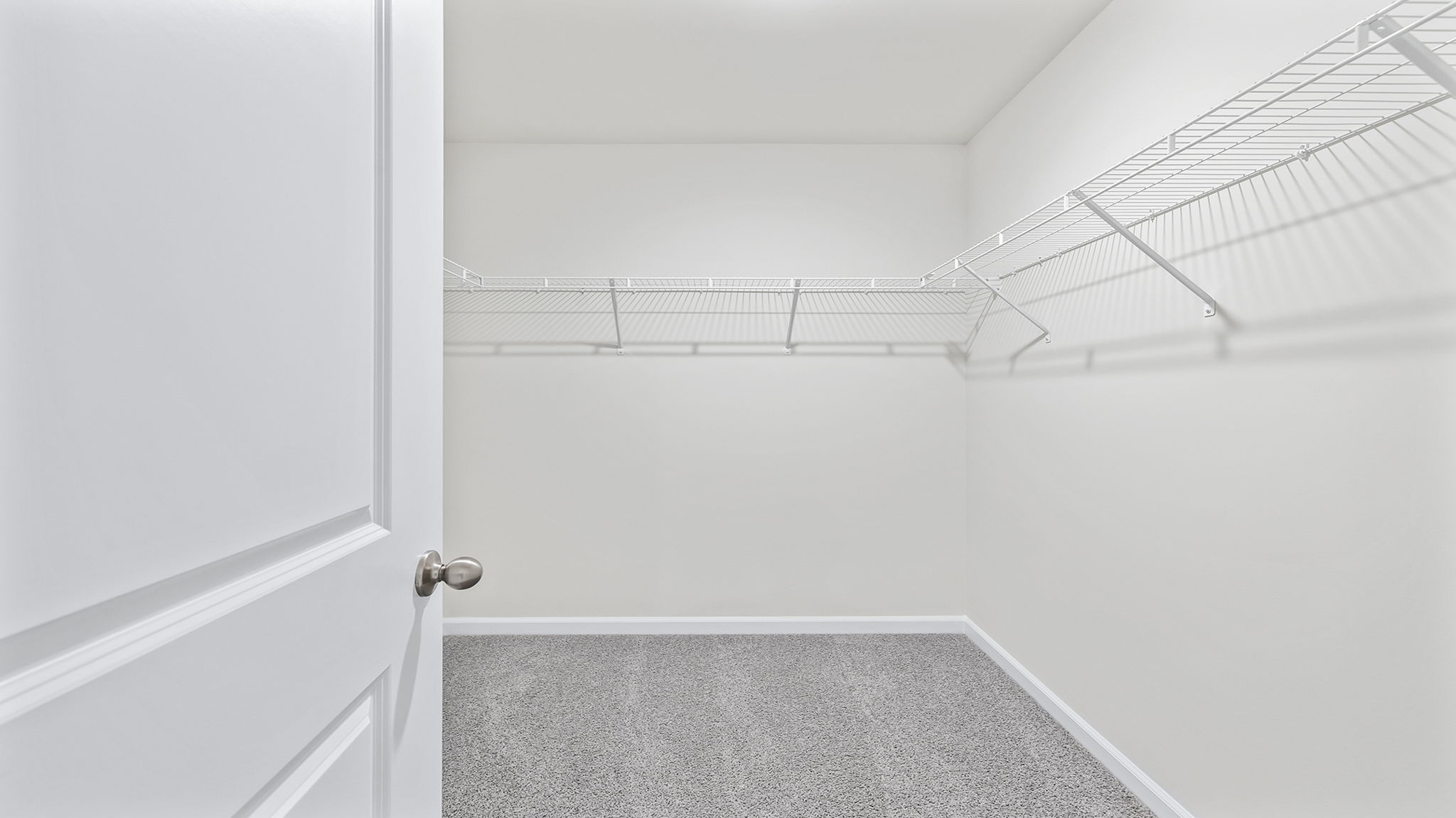 Closet with hanging storage racks.