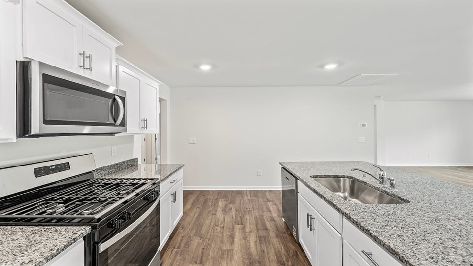 Kitchen with island and countertops.
