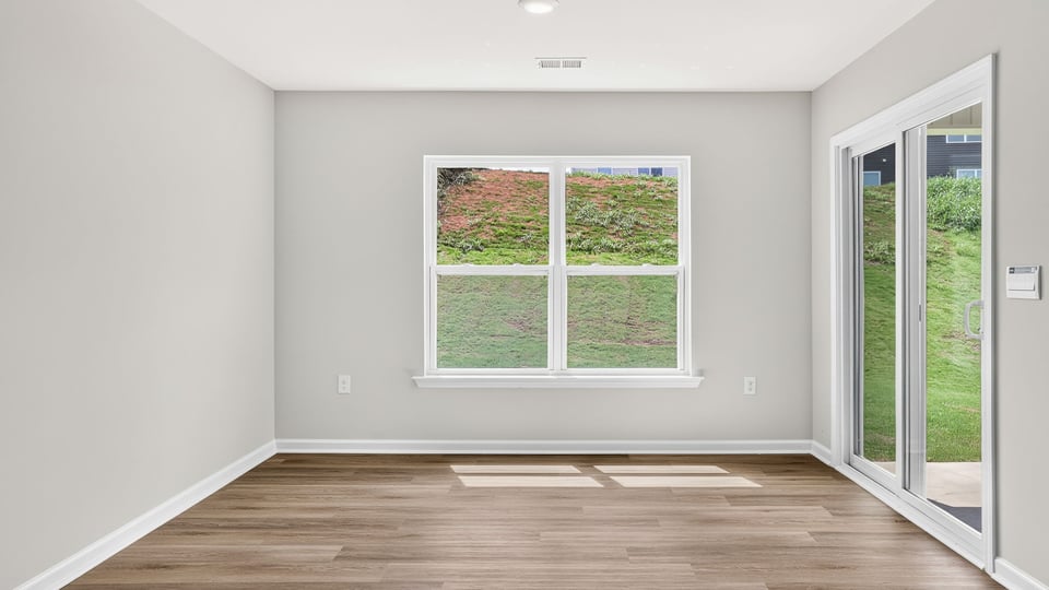 Bedroom with carpet and window.