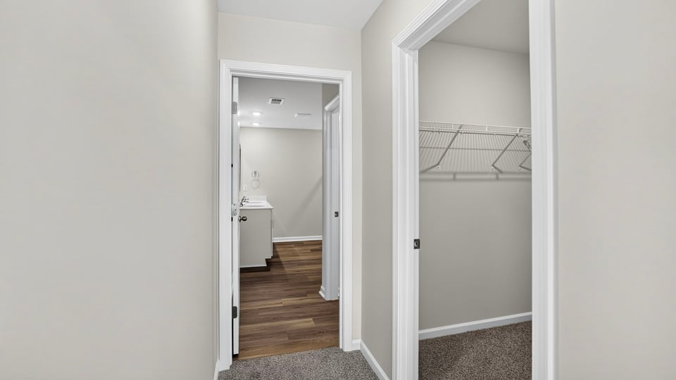 Bedroom with carpet and window.