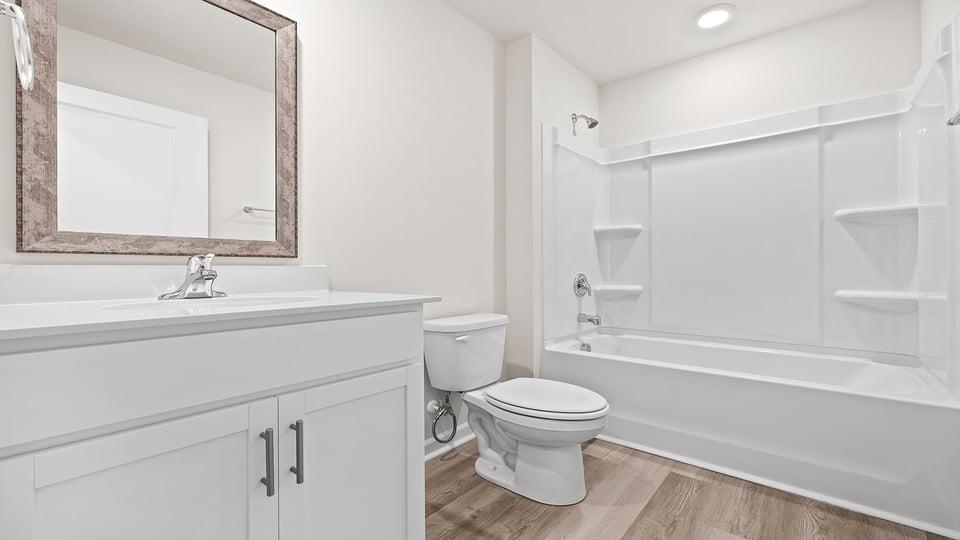 Bathroom with vanity and tub.
