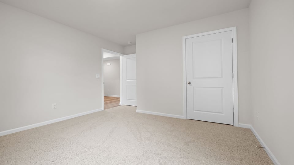 Bedroom with carpet.