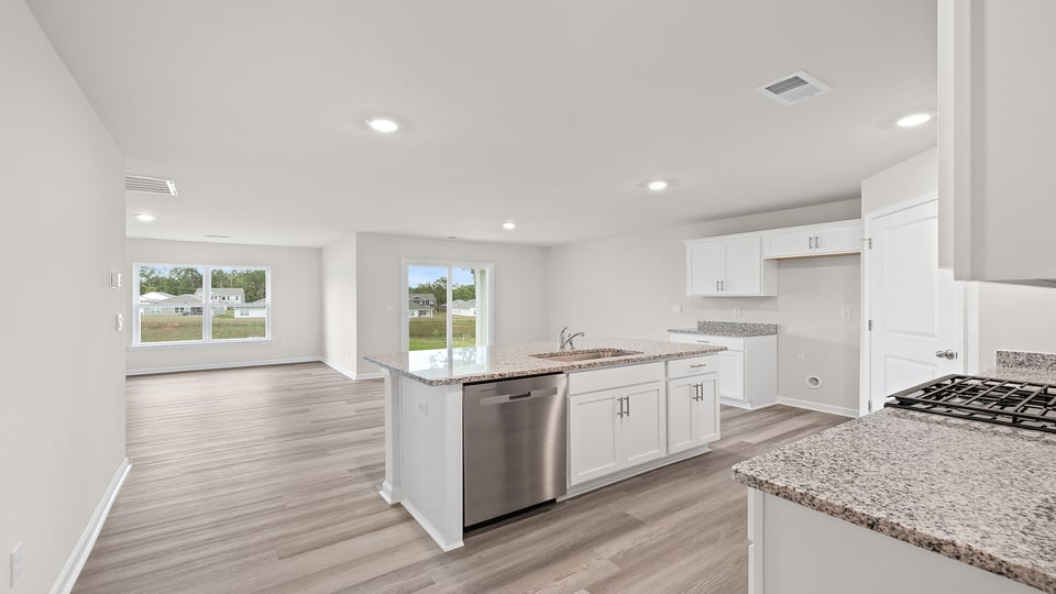 Kitchen and island with granite countertops.