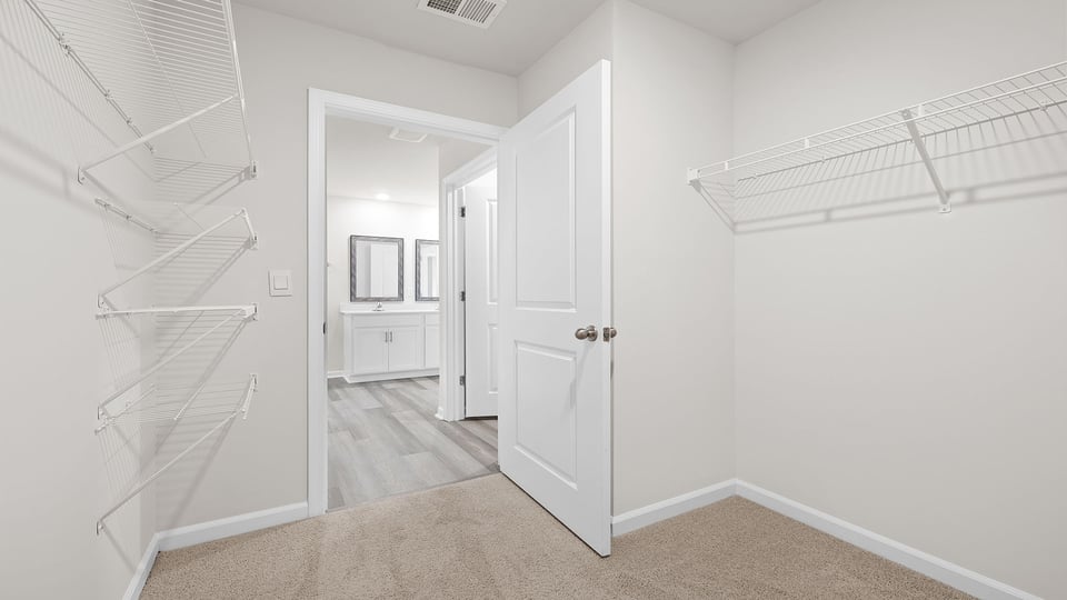 Walk in shower with shelves.