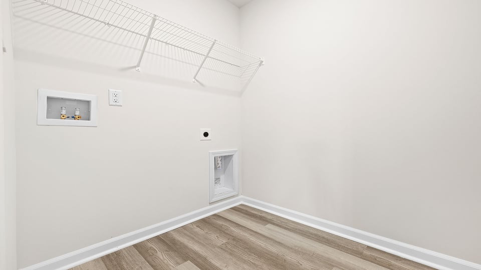 Walk in laundry with shelves.