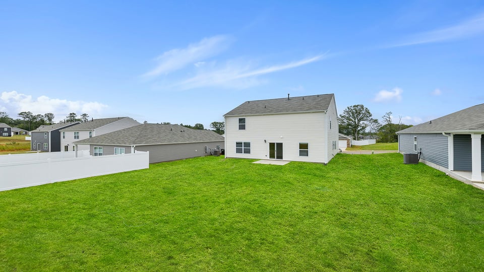 Exterior home with large backyard.