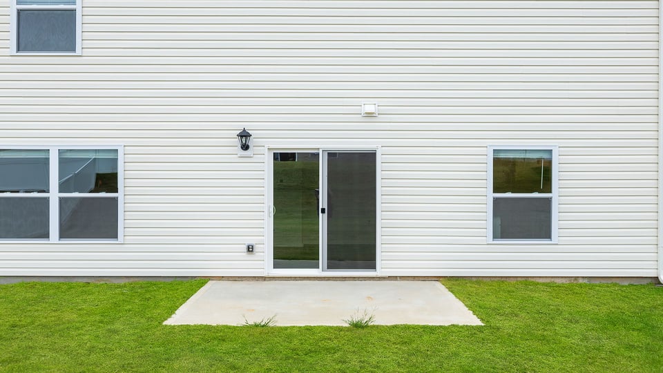 Exterior home with large backyard.