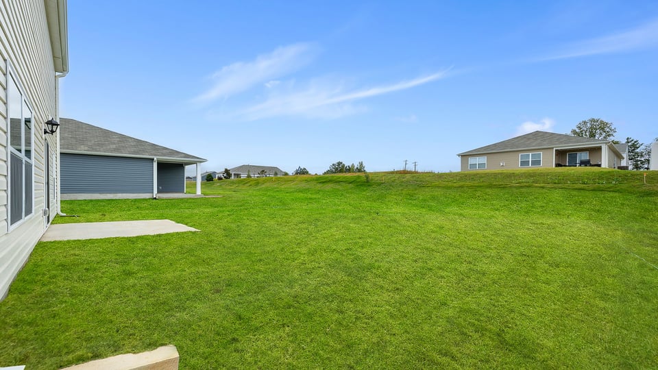Exterior home with large backyard.