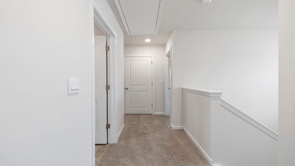 Hallway with carpet.