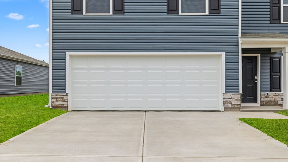 Grage and driveway of home.