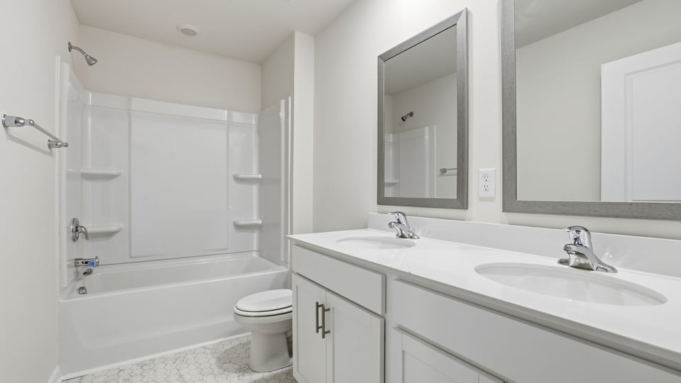 Double vanity with tub.