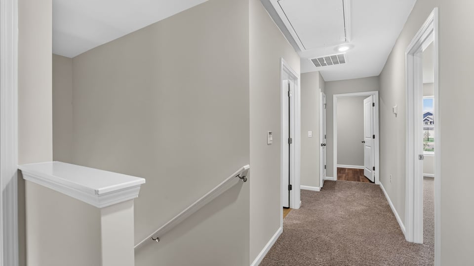Bedroom with carpet and window.