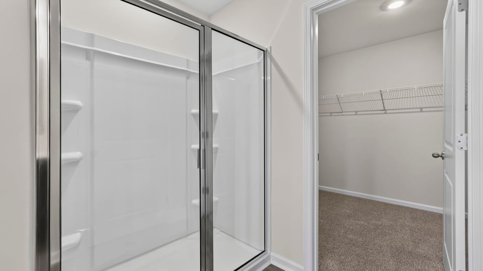 bathroom with walk in shower.,
